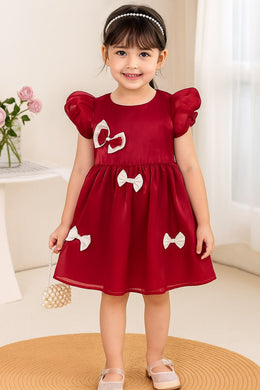 Little Girl in Red Bow Dress Trendy