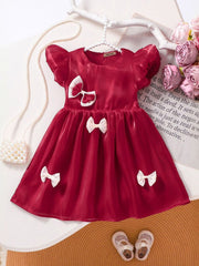 Little Girl in Red Bow Dress Trendy