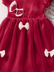 Little Girl in Red Bow Dress Trendy