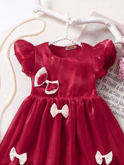Little Girl in Red Bow Dress Trendy