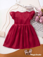 Little Girl in Red Bow Dress Trendy